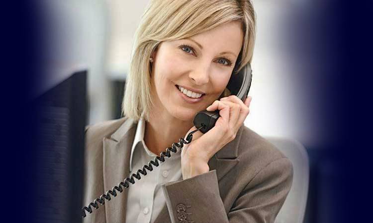 woman in a suit on the phone