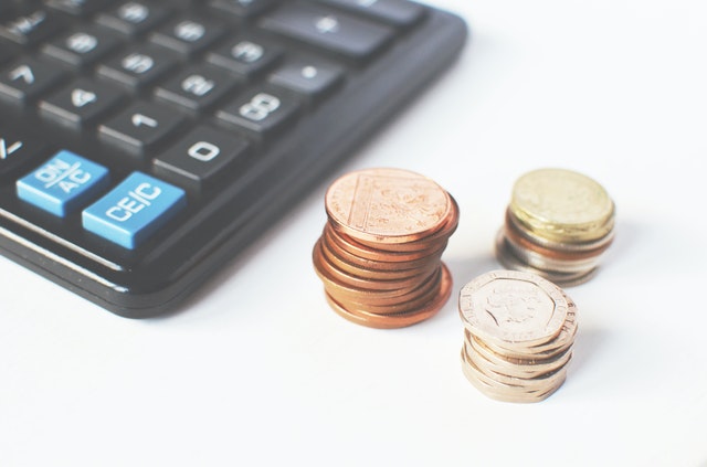 pile of change next to a calculator
